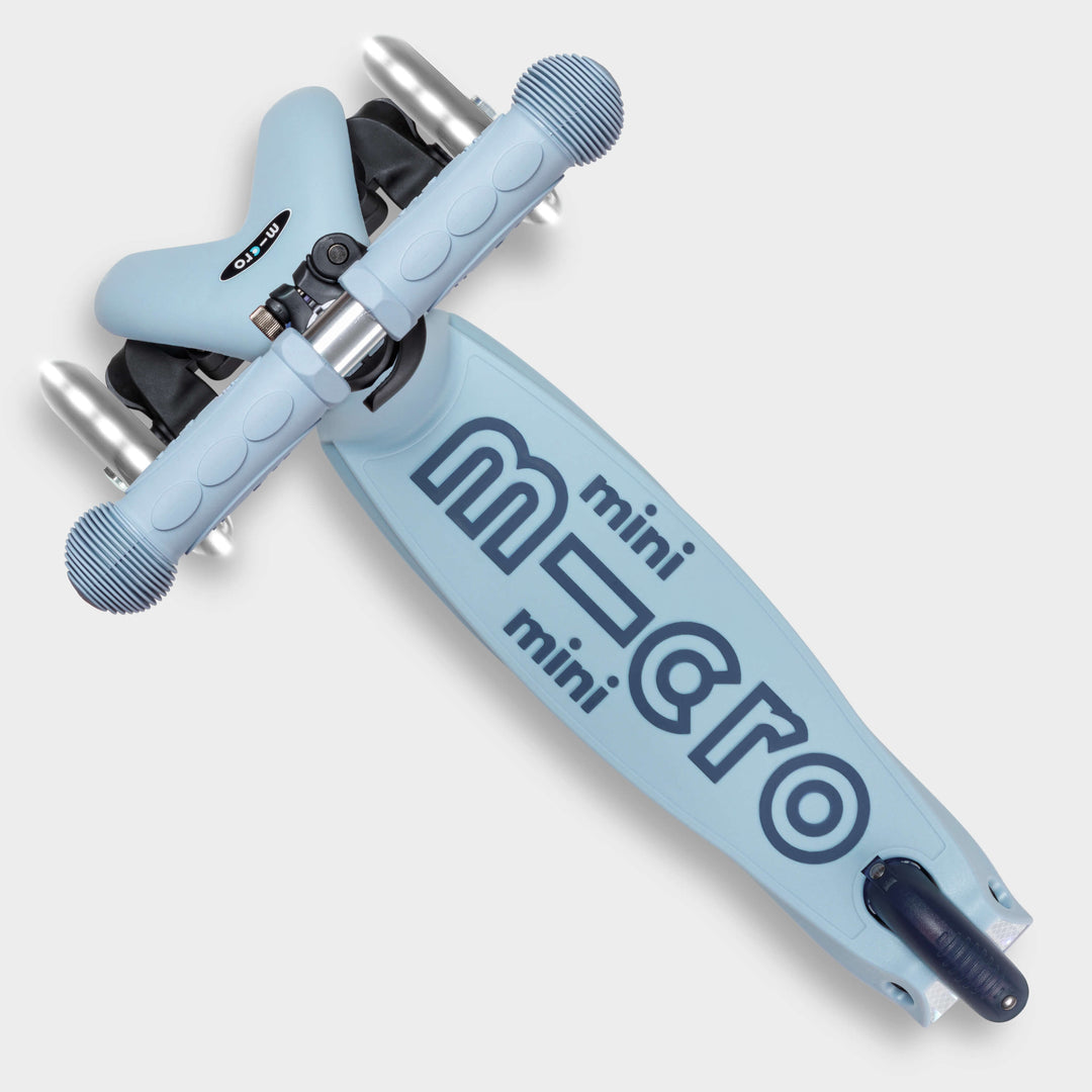 Top-down view of the soft blue Micro Mini2Grow Deluxe deck with the mini micro logo