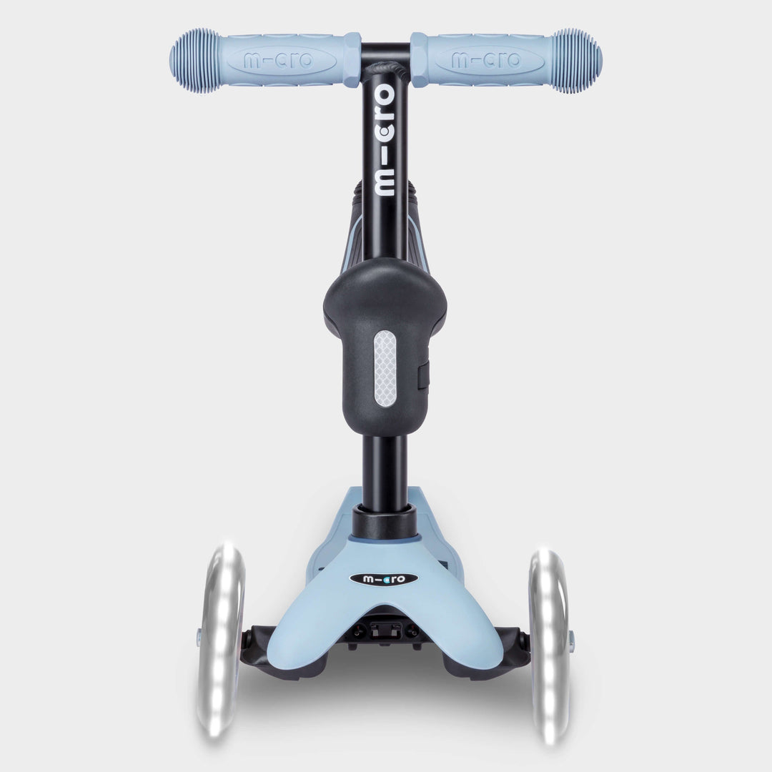Front view of the soft blue Micro Mini2Grow Deluxe scooter with light-up front wheels