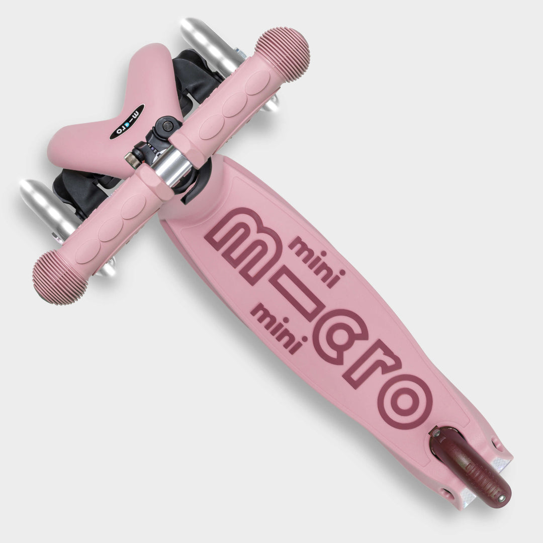 Top-down view of the rose pink Micro Mini2Grow Deluxe deck with the mini micro logo
