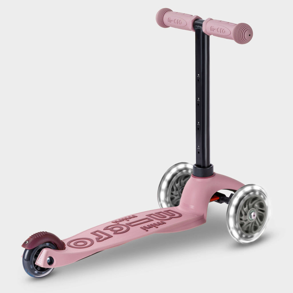 Rose pink Micro Mini2Grow Deluxe LED set up as a three-wheel scooter, side view