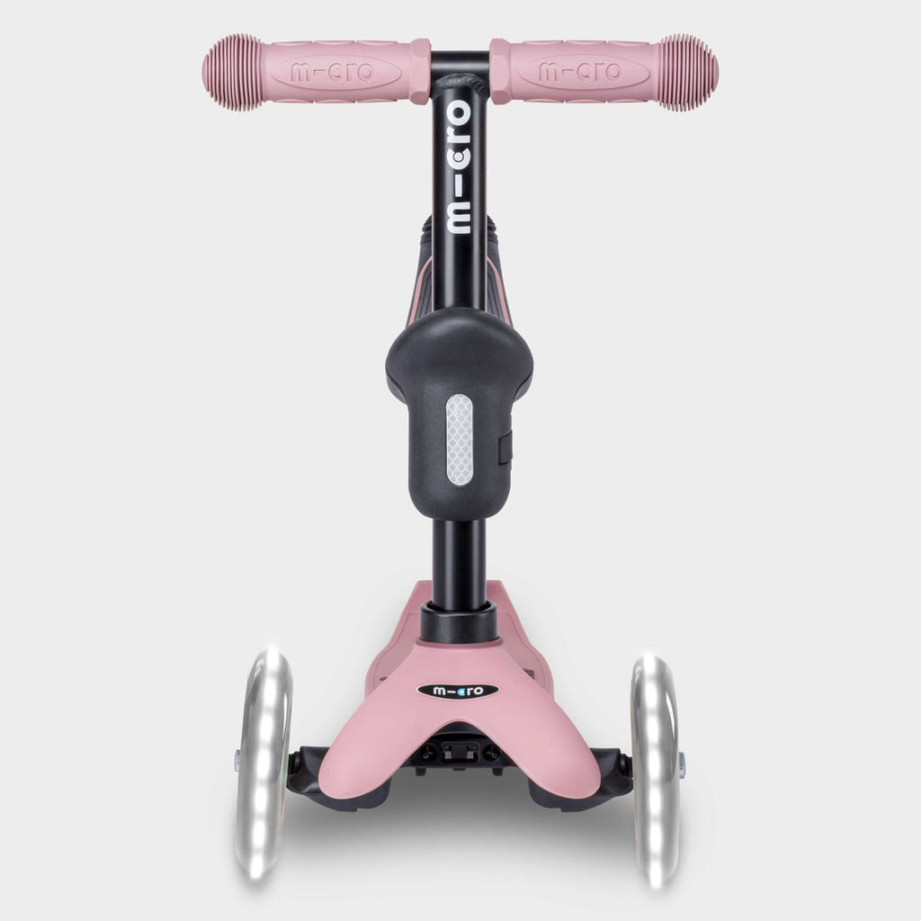 Front view of the rose pink Micro Mini2Grow Deluxe scooter with light-up front wheels