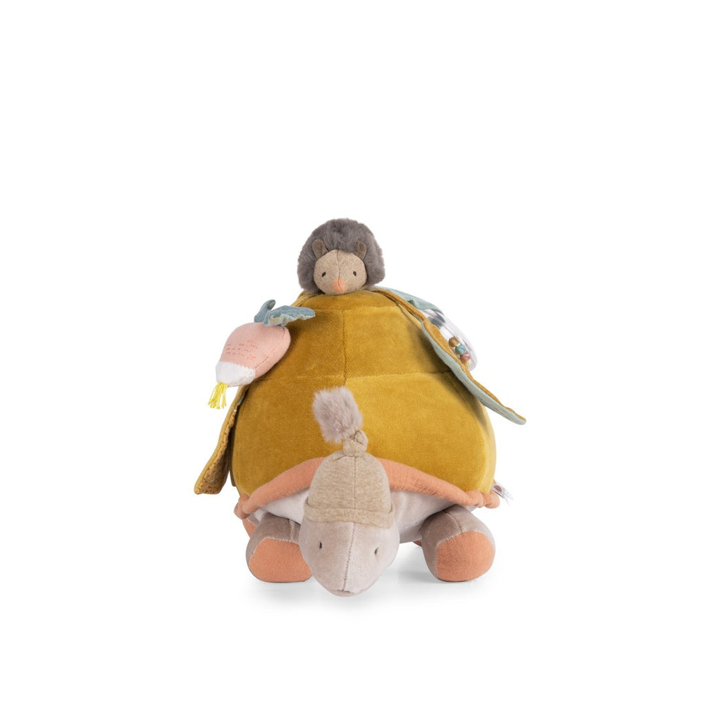 Moulin Roty large activity turtle seen from the front with its knitted hat and hedgehog on top