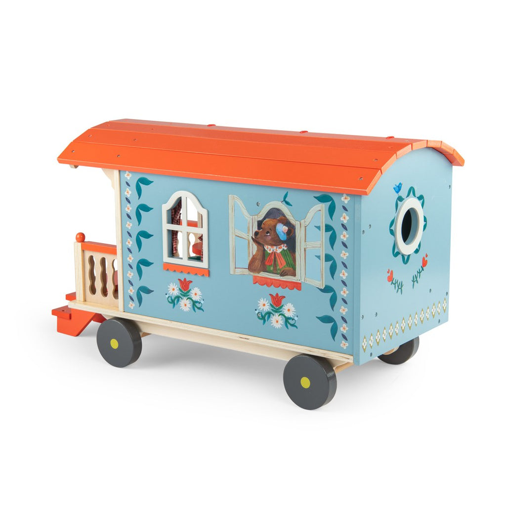 Moulin Roty wooden caravan rear three-quarter view with round porthole window
