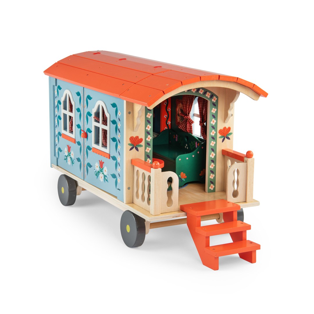 Moulin Roty wooden caravan front with painted arched doorway and green interior