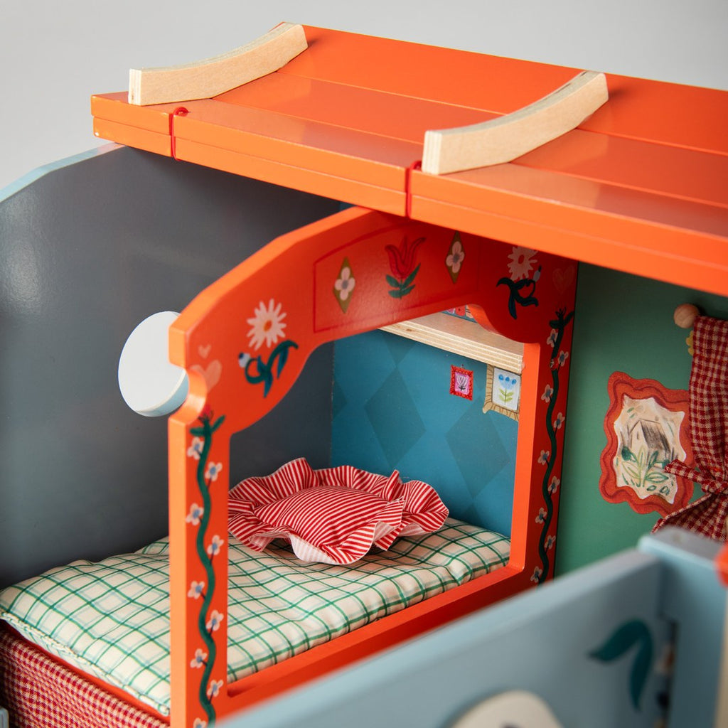 Close-up of the caravan bed alcove with the roof lifted