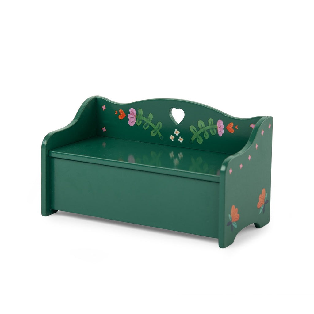 Green painted wooden bench from the Moulin Roty caravan, angled view