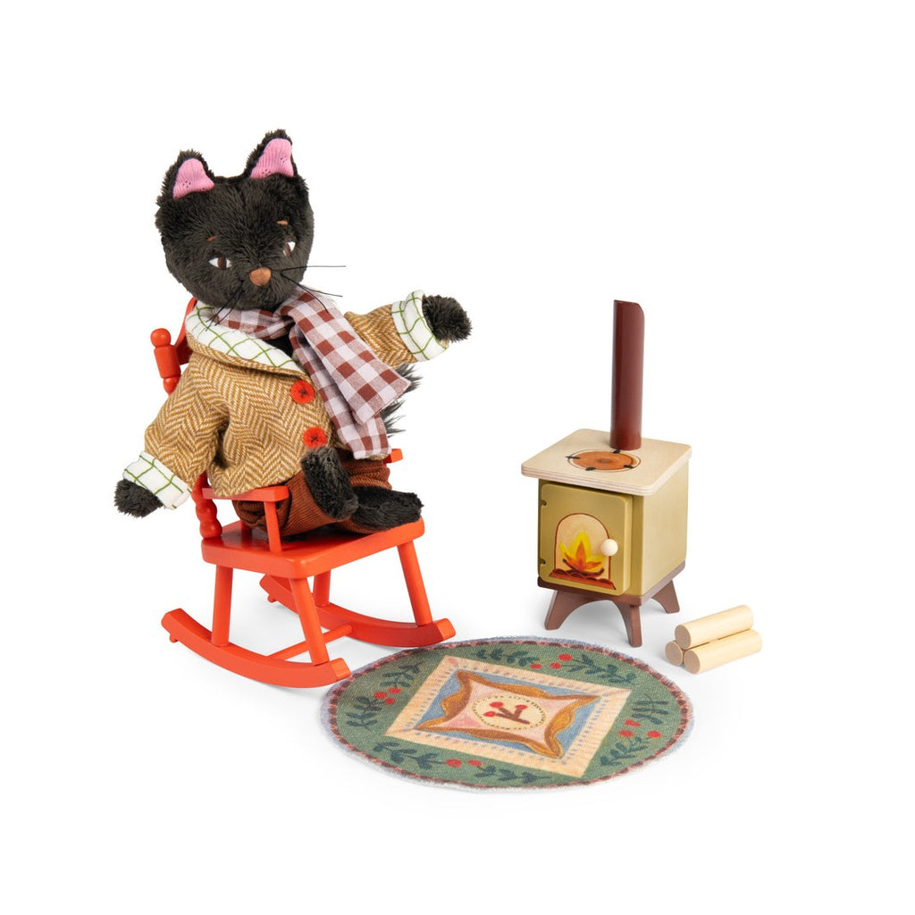 Black cat doll in the rocking chair from the Moulin Roty cosy living room set