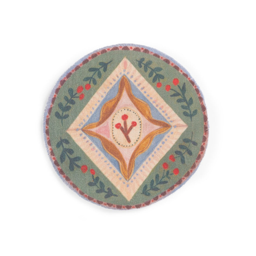 Round fabric rug with folk pattern from the Moulin Roty cosy living room set