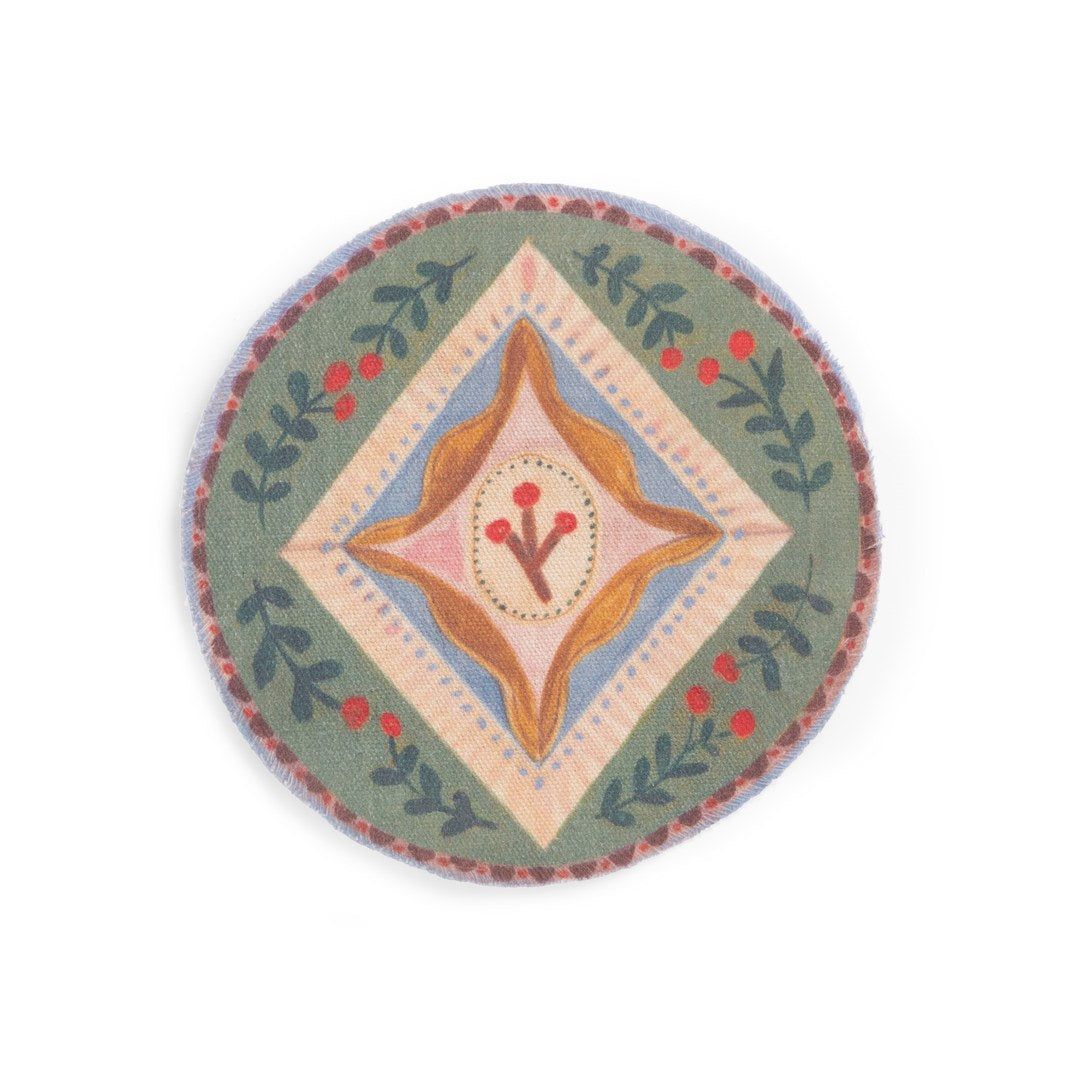 Round fabric rug with folk pattern from the Moulin Roty cosy living room set