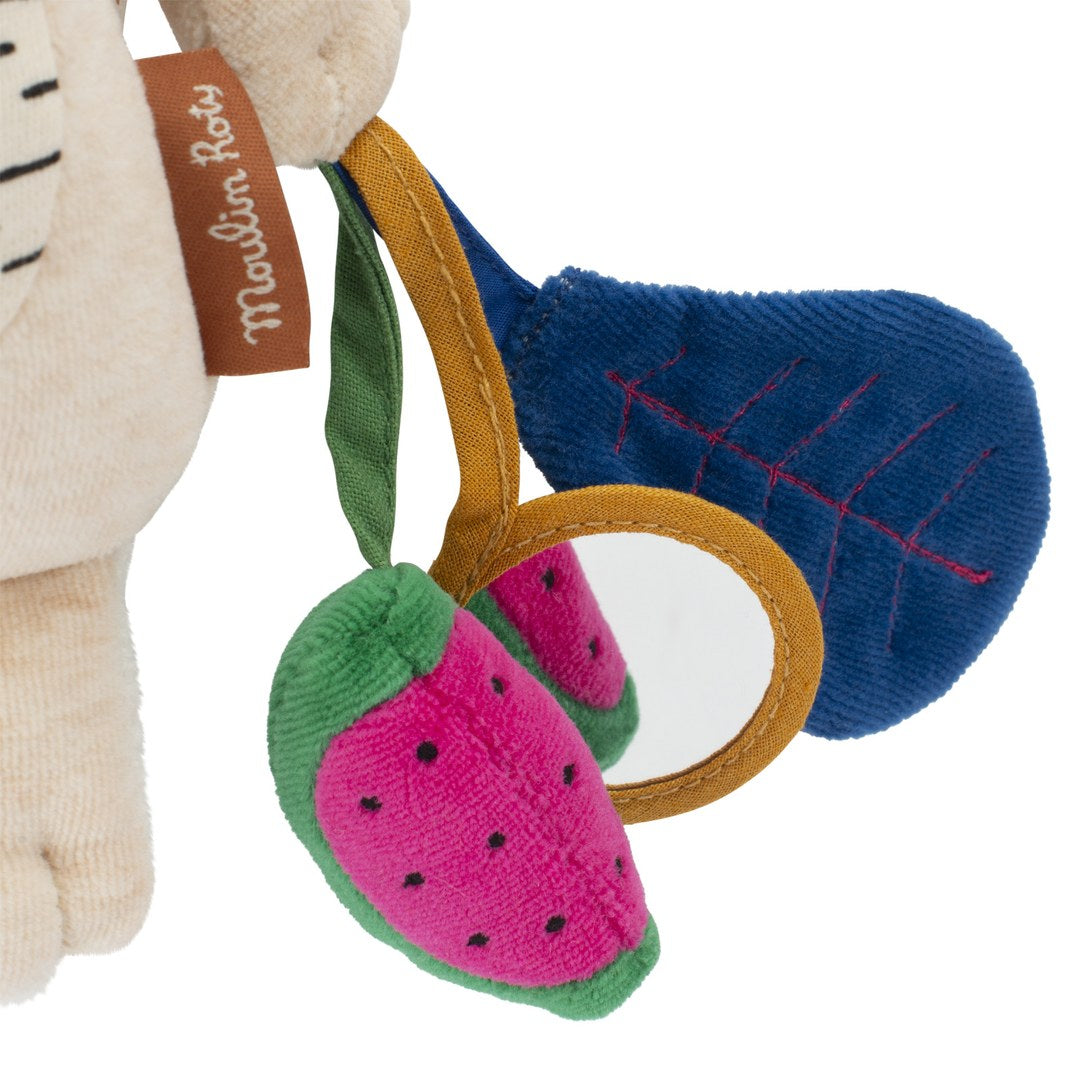 Close-up of the watermelon, baby mirror and corduroy leaf on the Moulin Roty activity tiger