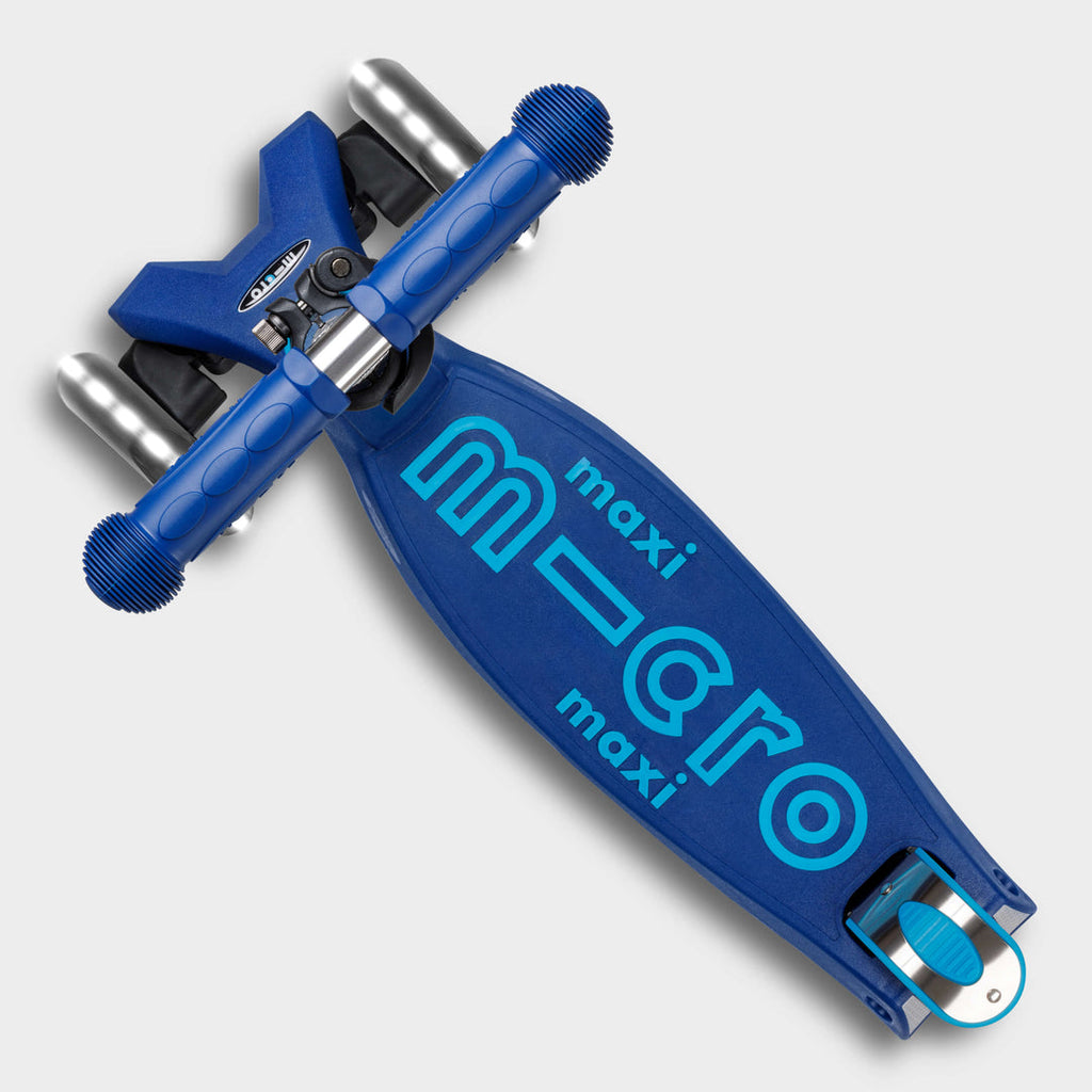Top-down view of the navy Maxi Micro Deluxe deck with the light-blue micro maxi logo