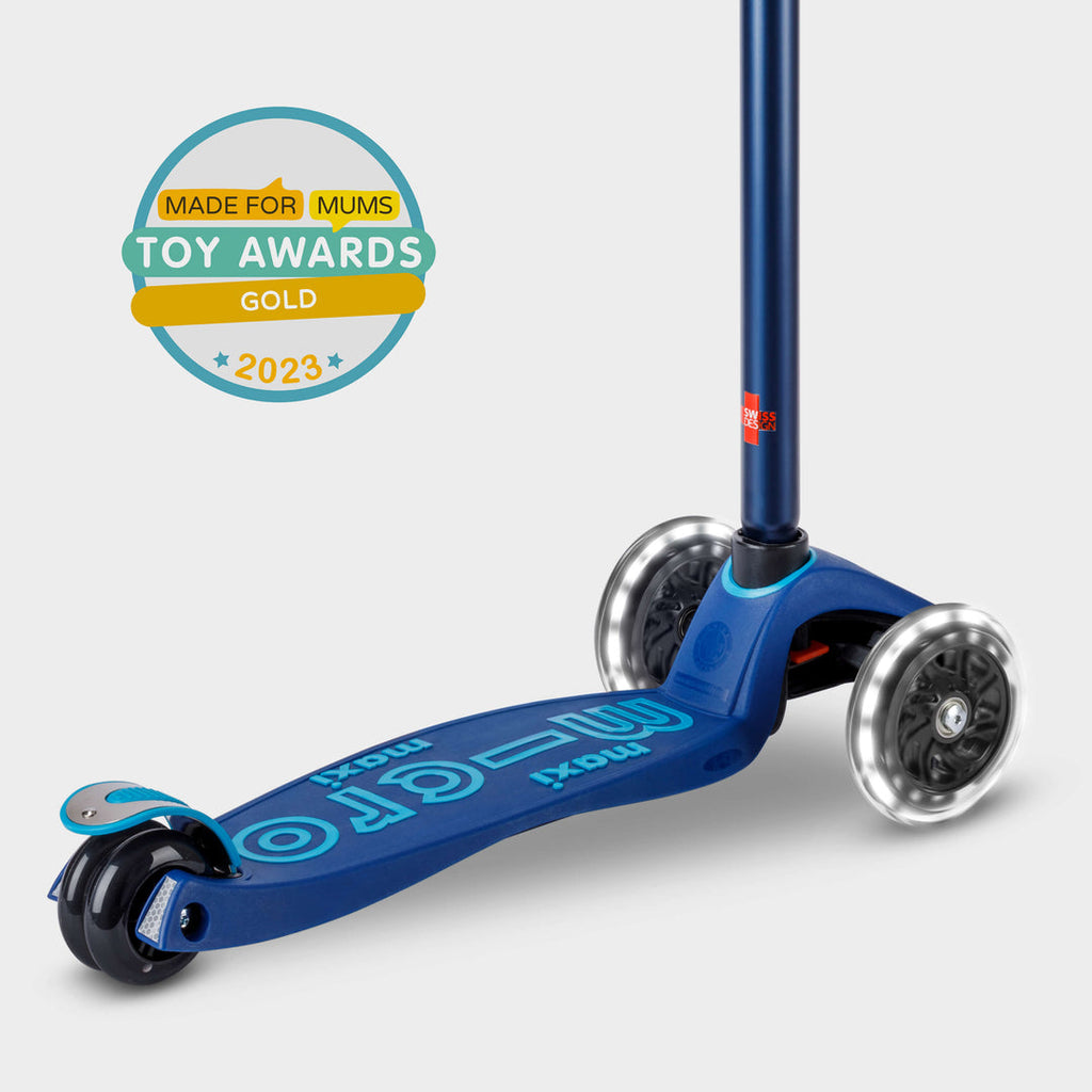Navy Maxi Micro Deluxe LED scooter with the Made for Mums Toy Awards 2023 Gold badge