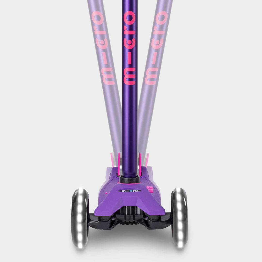 Front view of the purple Maxi Micro Deluxe LED handlebar tilting left and right to show lean-to-steer