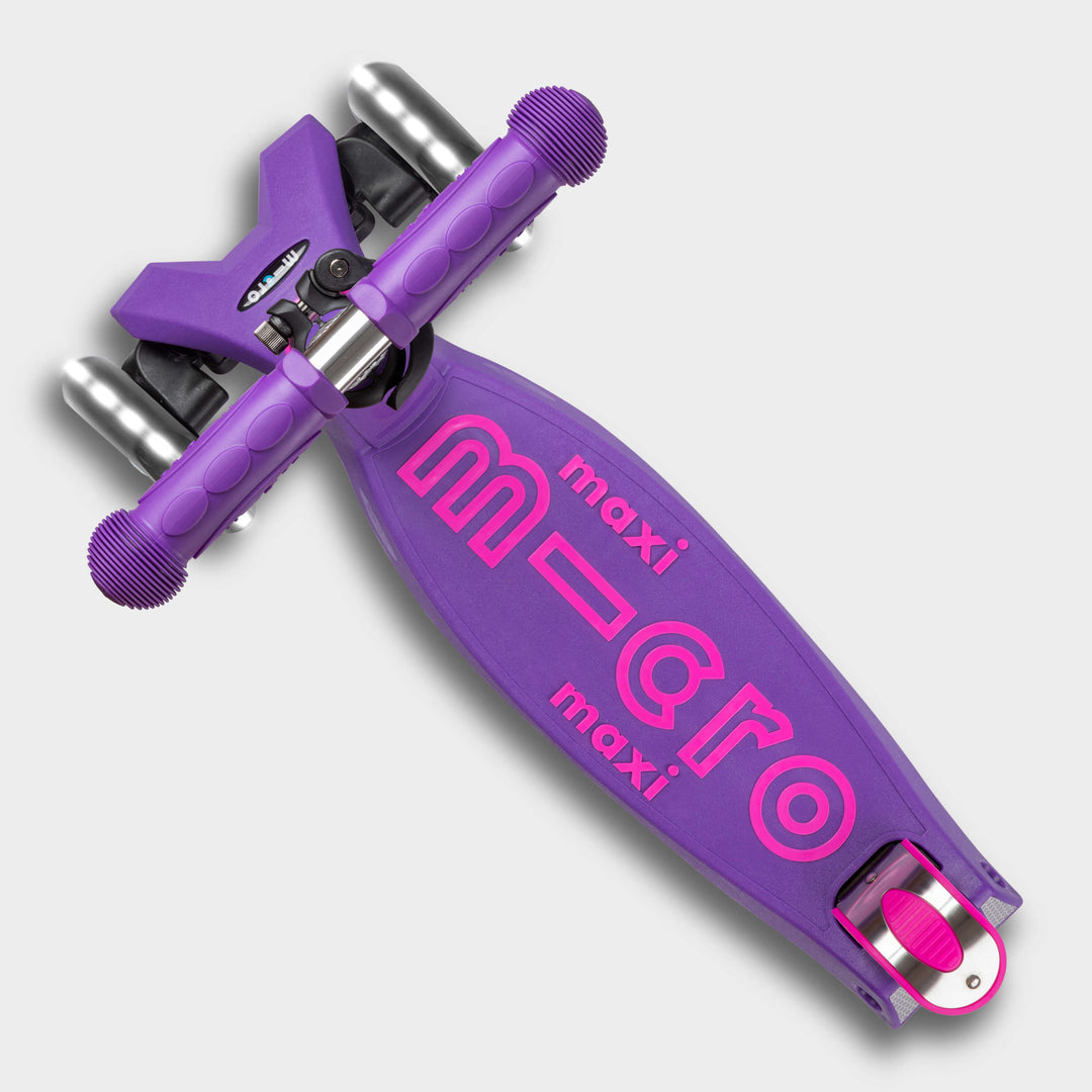 Top-down view of the purple Maxi Micro Deluxe deck with the pink micro maxi logo