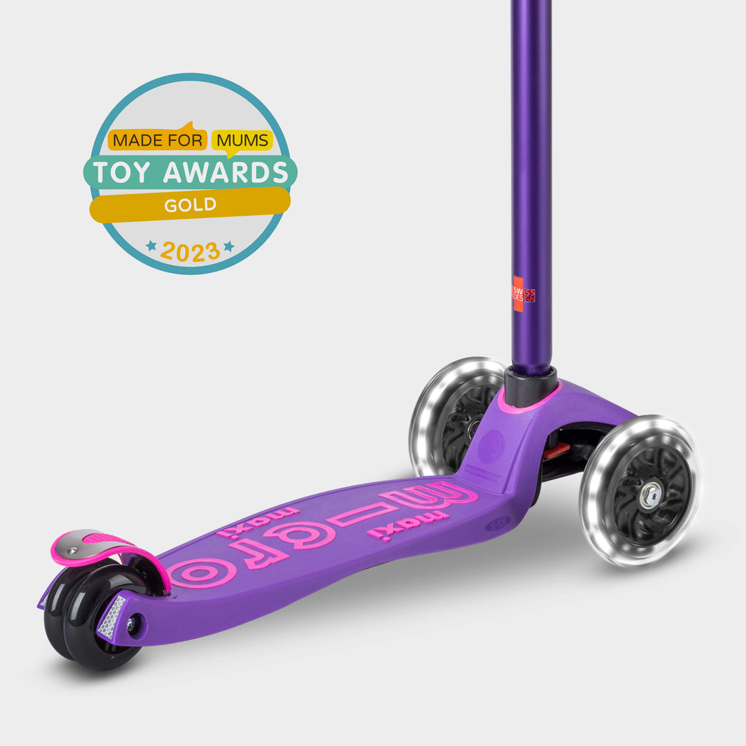 Purple Maxi Micro Deluxe LED scooter with the Made for Mums Toy Awards 2023 Gold badge