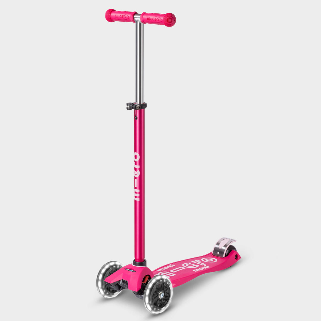 Maxi Micro Deluxe LED scooter in pink with light-up wheels, side view