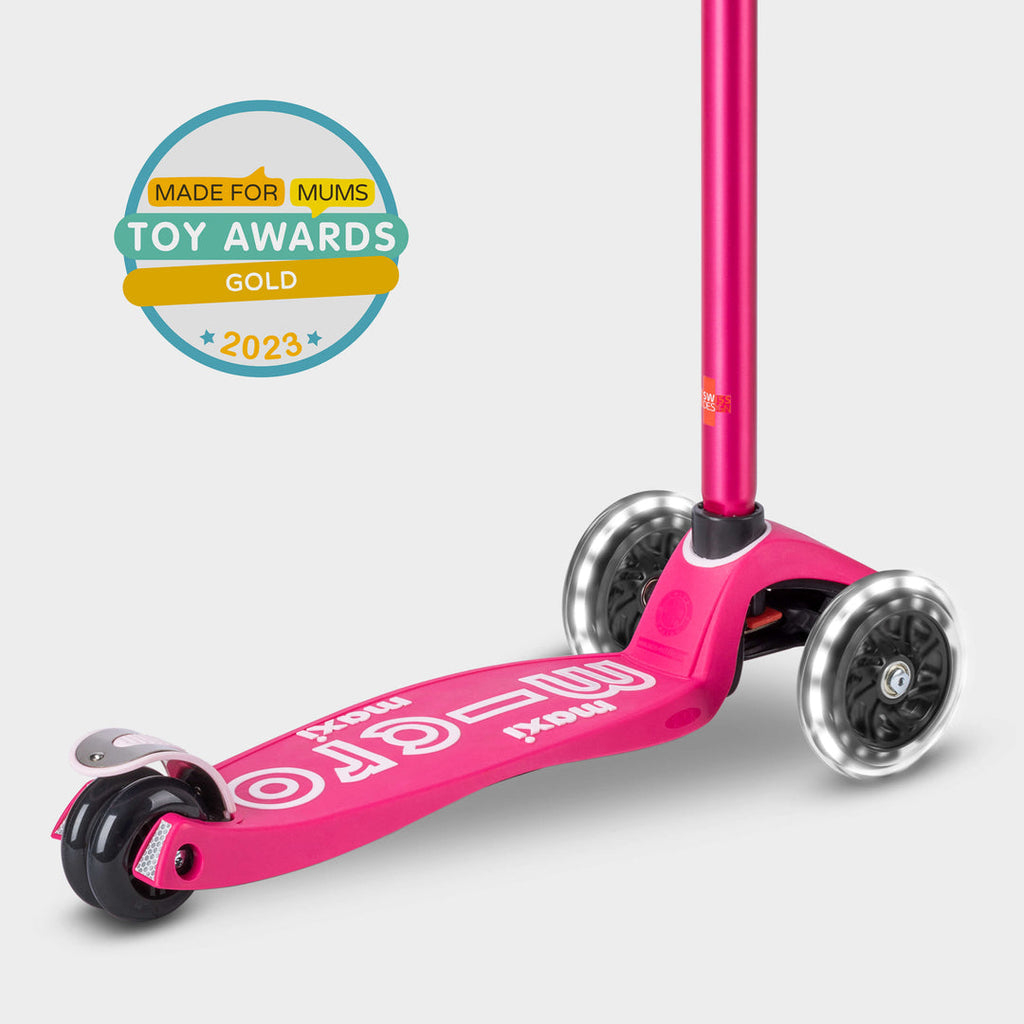 Pink Maxi Micro Deluxe LED scooter with the Made for Mums Toy Awards 2023 Gold badge