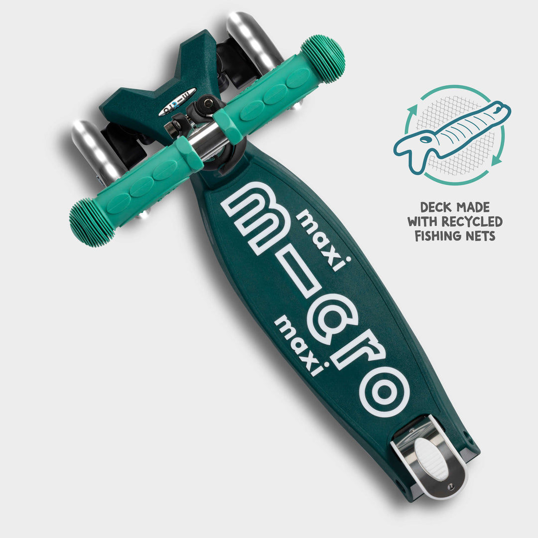 Top-down view of the green Maxi Micro Eco deck with a badge reading deck made with recycled fishing nets