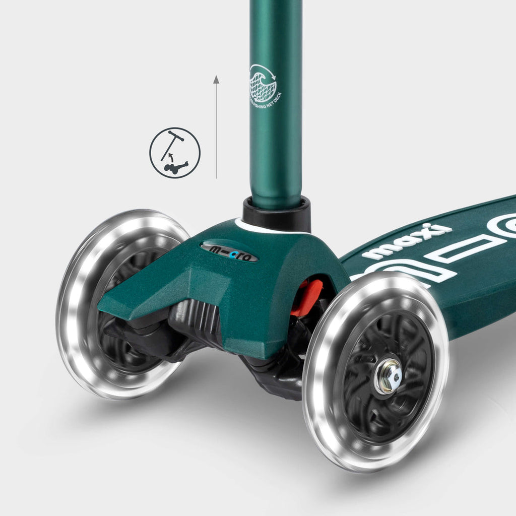 Close-up of the green Maxi Micro Eco front wheels lit up, with a handlebar height-adjust icon