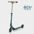 Micro Sprite LED two-wheel scooter in dark green with cork handlebar grips and light-up wheels, with the Eco Collection logo