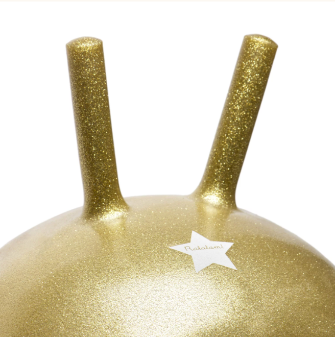 Gold glittery Gold space hopper jump ball on white background