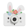 Children's camera with bunny design and flowers on a white background