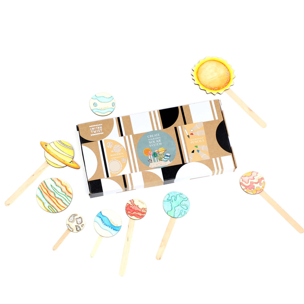 Set of colourful planet shaped artwork with a box on a white background