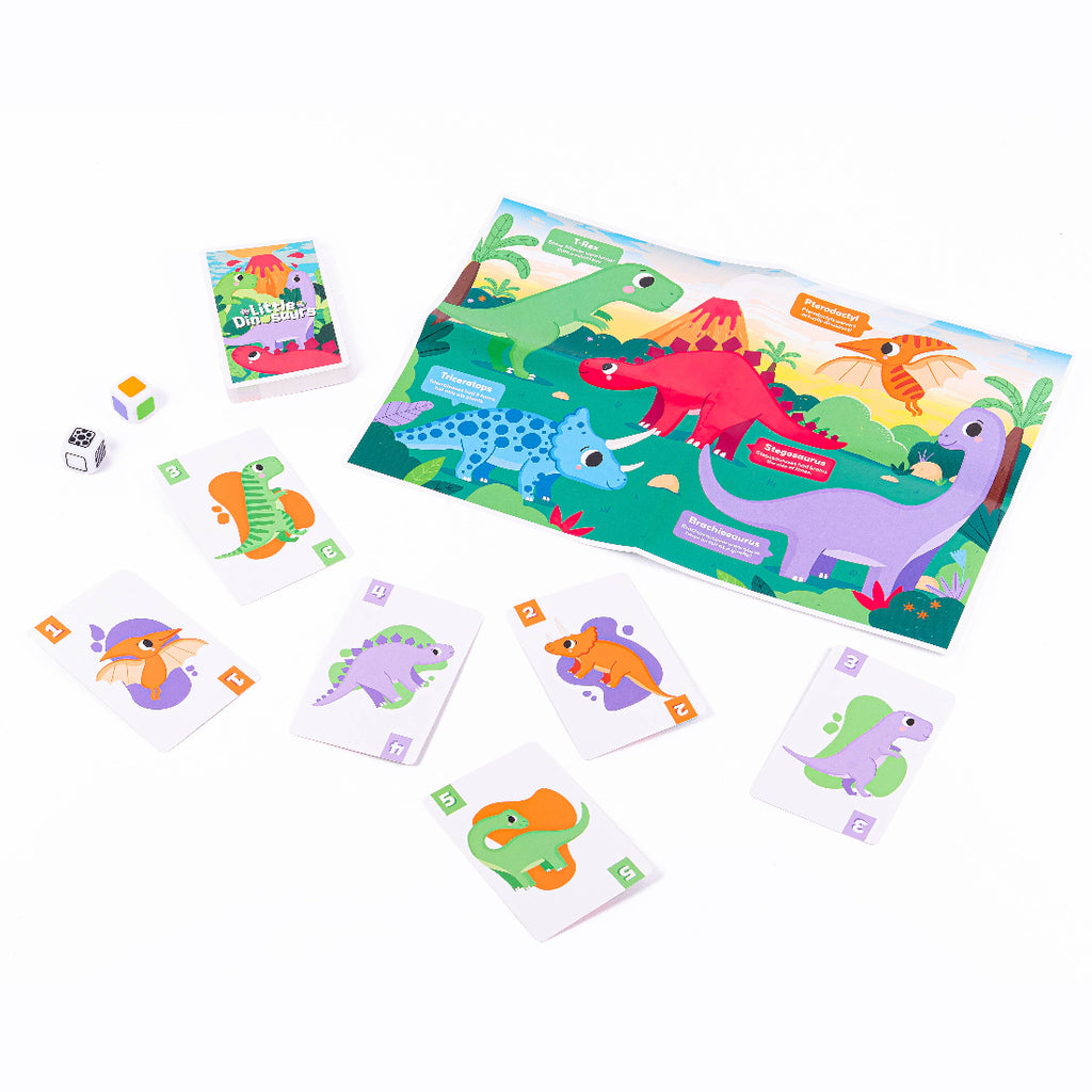 Children's dinosaur-themed game set with cards and a mat on a white background