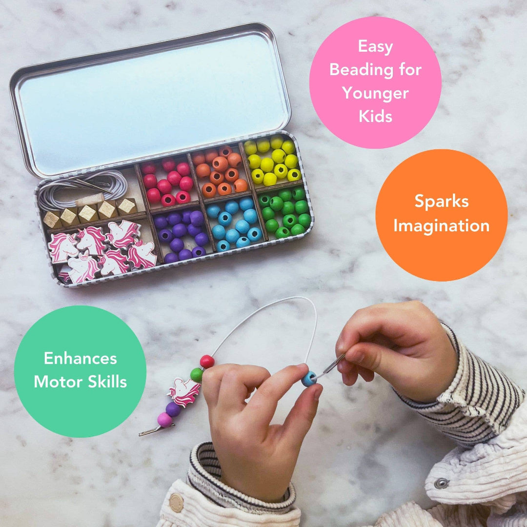 Colourful bead set in a tin with a child beading, on a marble surface.