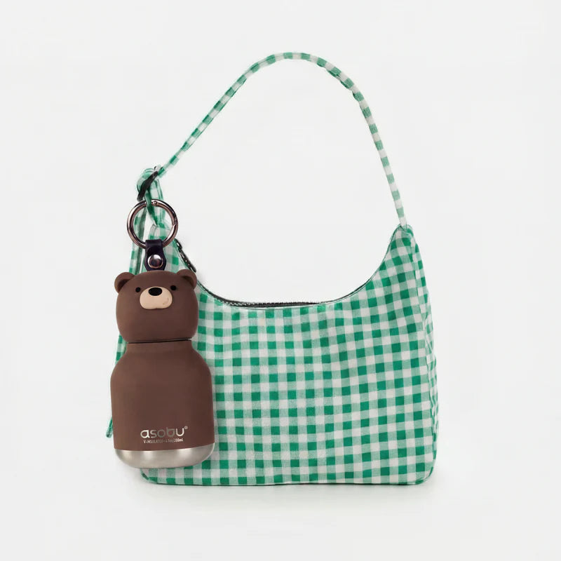 Green checkered handbag with a bear-shaped bottle holder on a white background