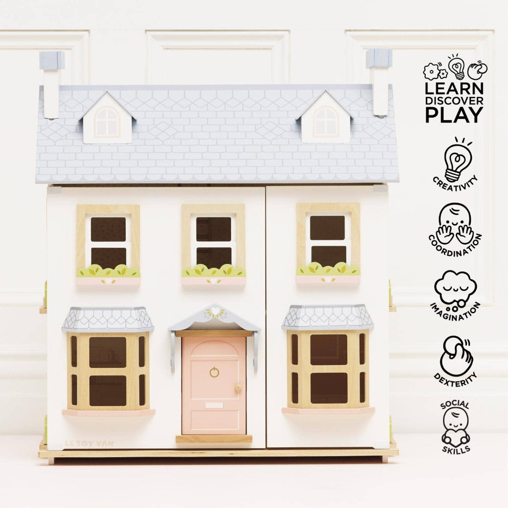 Dolls house with a pink door on a white background, featuring the 'Learn Discover Play' logo.