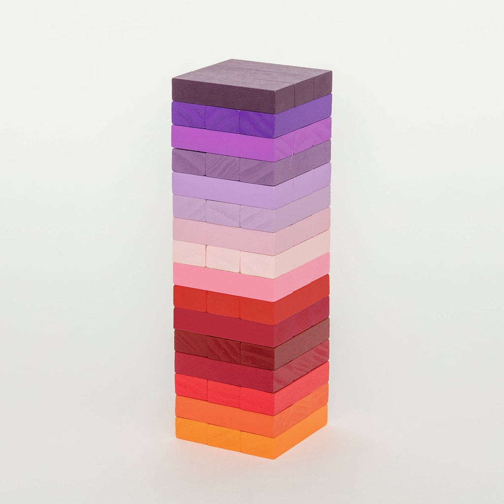 Block Design Warm Gradient Tower, a wooden tumbling tower game with painted blocks in a pink, coral and red gradient, image 2