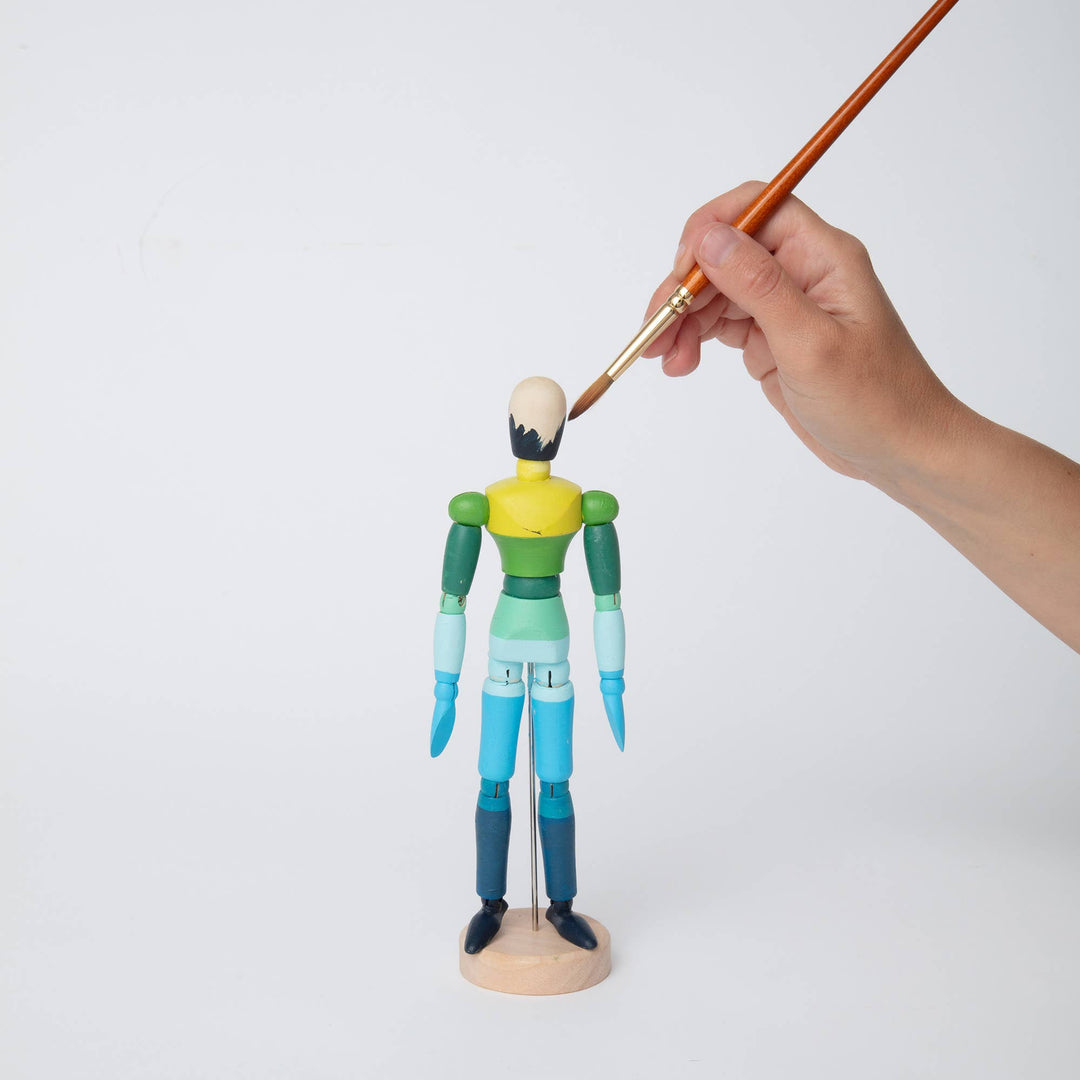 Block Design Paint and Pose kit, a wooden artist's mannequin with 12 paint colours and two brushes, image 4