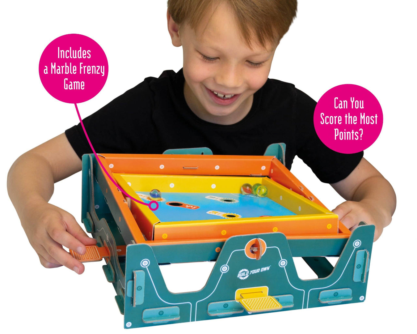 Child playing with a marble run toy set, with text about included games and scoring.