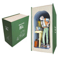 A boxed collectible or display set shown on a white background: a green box labeled 'Rolodex of the BFG' beside an open book-shaped display featuring a standing figure inside a cave-like archway with small accessories and a miniature scene.