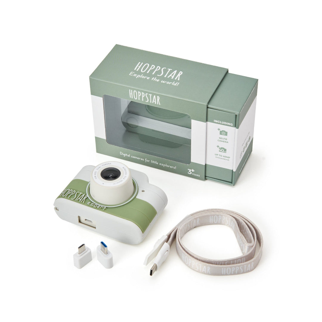 Hoppstar digital camera with strap and packaging on a white background
