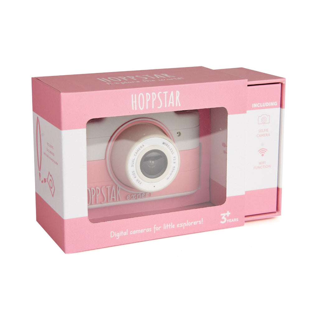 Pink Hoppstar digital camera toy in its original retail packaging, featuring a clear window that displays the toy camera inside.