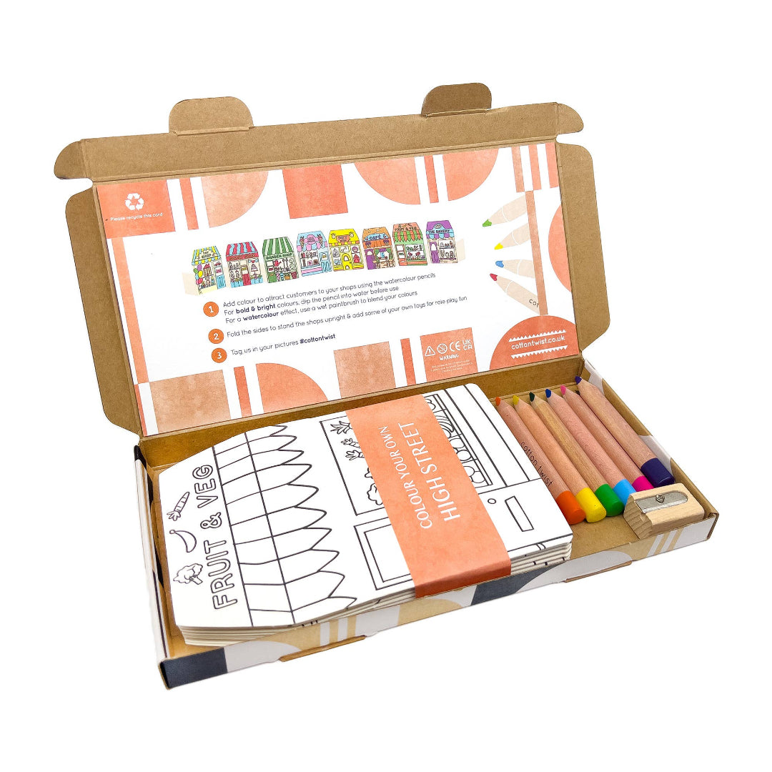 Colouring set with coloured pencils and a cardboard cover on a white background