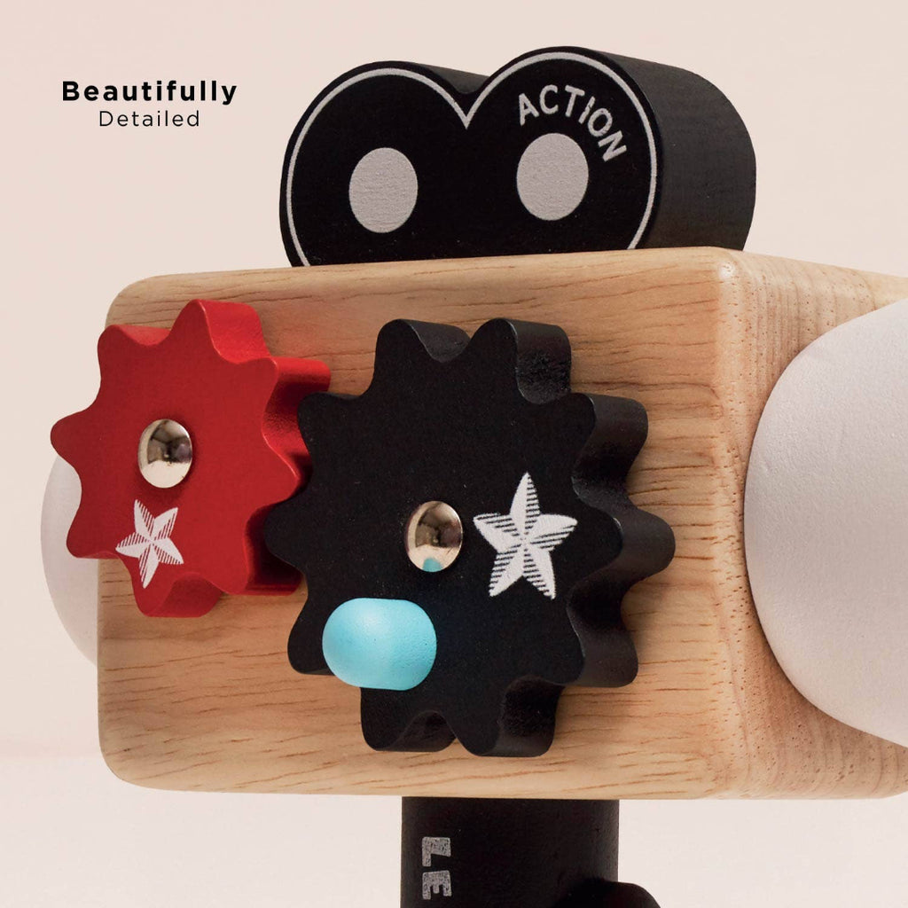 Toy camera with detailed gears on a beige background