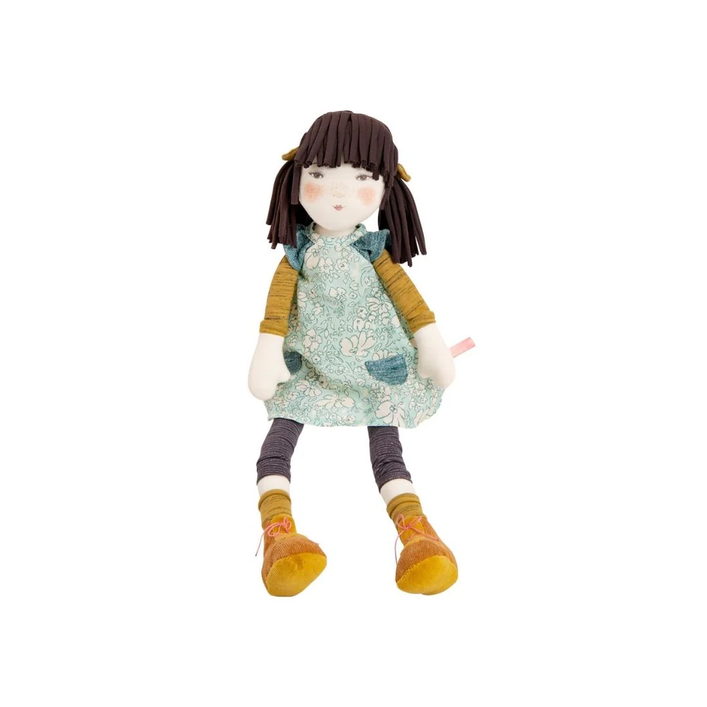 Stuffed doll with a floral dress and yellow boots on a white background
