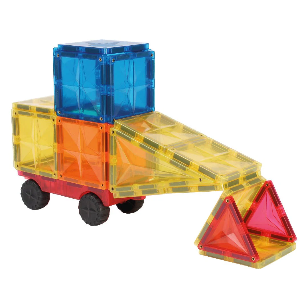 Colorful toy truck made of interlocking blocks on a white background