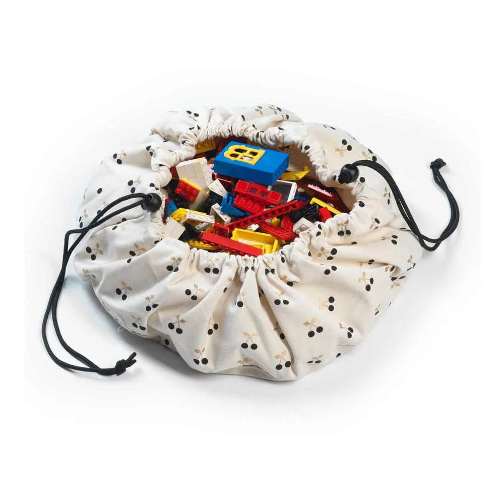 Drawstring bag with colorful toy blocks on a white background