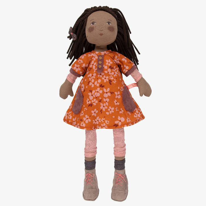 Doll with an orange floral dress on a white background