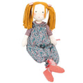 Stuffed doll with yellow hair and floral dress on a white background
