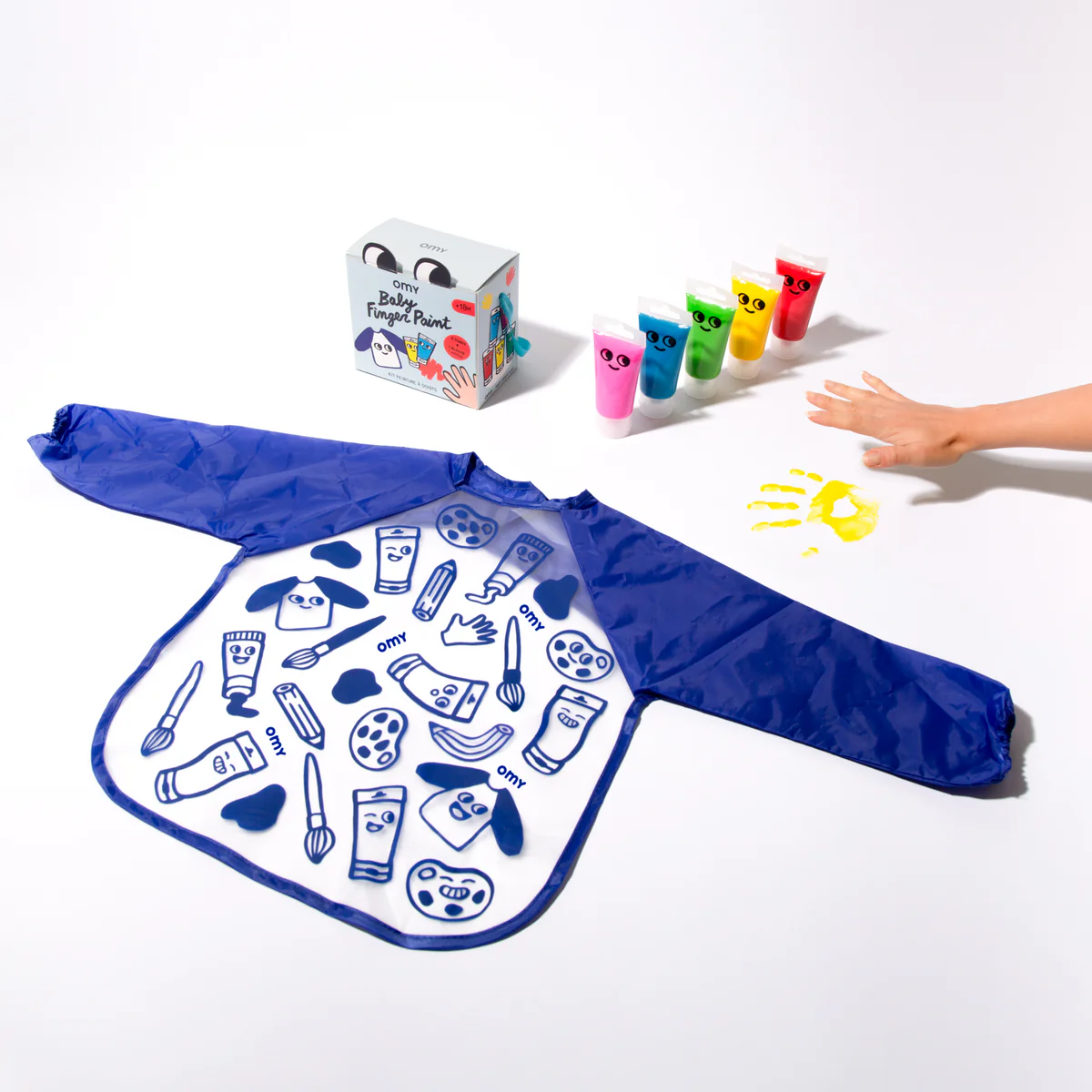 kids blue and clear plastic painting smock decorated with illustrations of painting tools 5 tubes of paint and packaging.