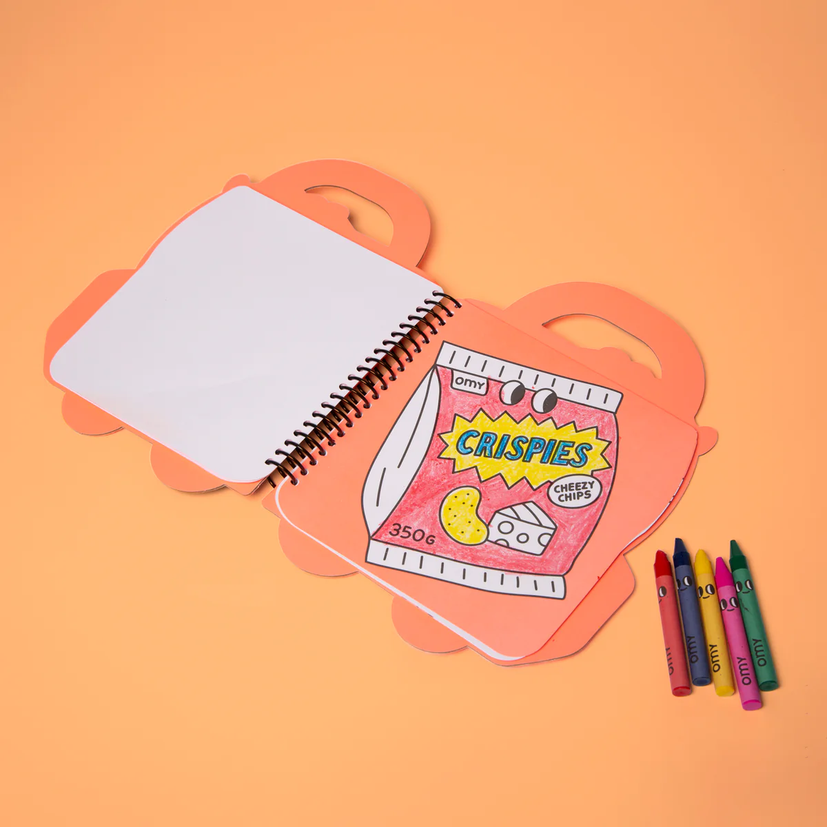 Notebook with a colorful cereal box design on an orange background