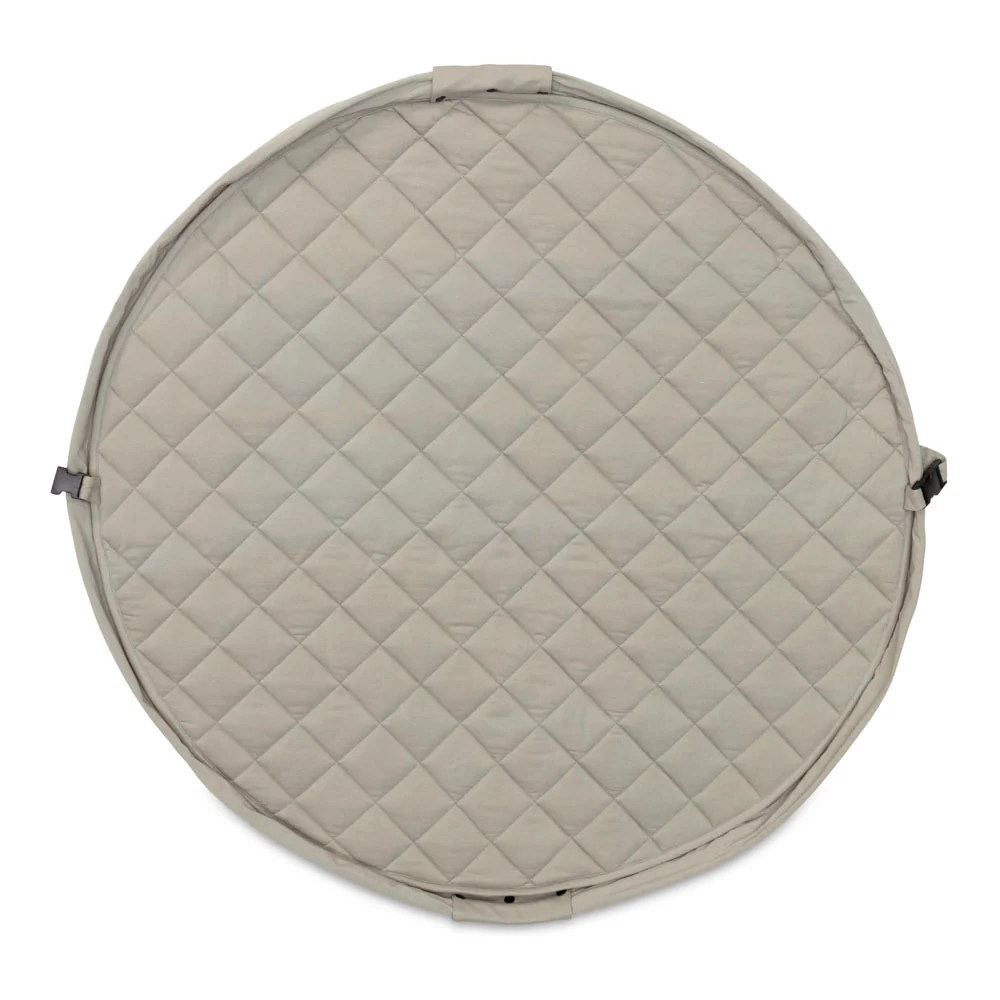 Round quilted mat with diamond pattern on a white background