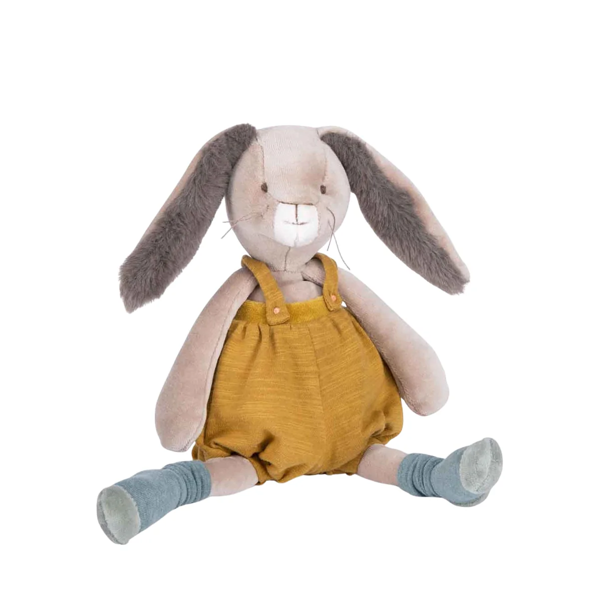 Stuffed bunny toy wearing mustard yellow overalls on a white background