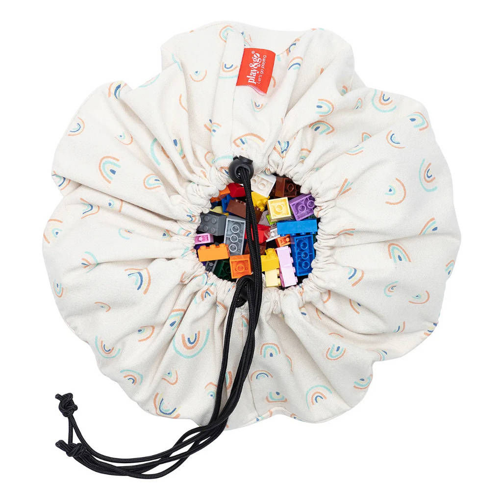 Drawstring bag with colorful building blocks and a visible brand logo on a white background