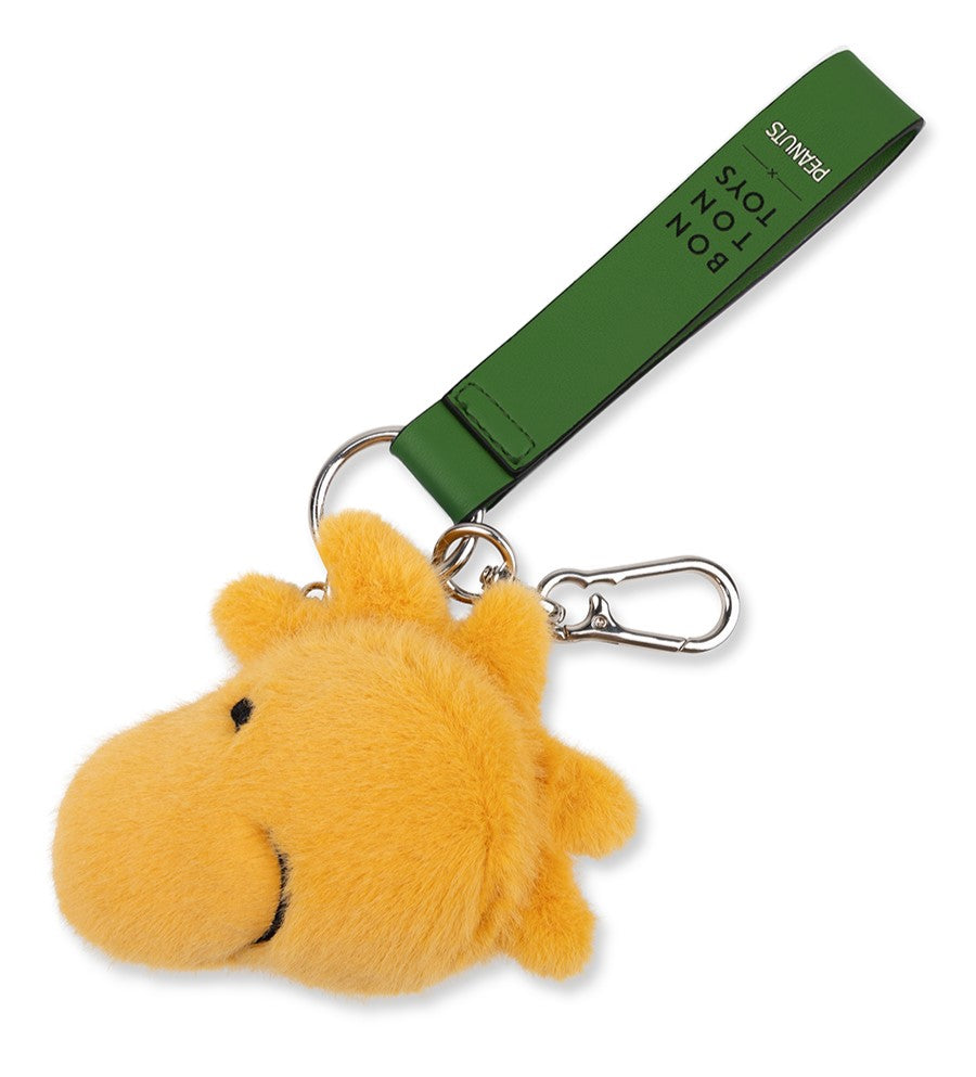 Yellow plush keychain with a green strap on a white background